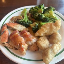 chicken wrapped in bacon, broccoli, crab leg, sweet and sour chicken