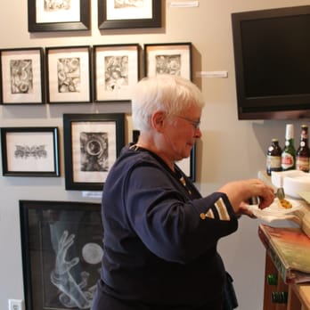 Wine Bar and Art Gallery - a man serving food - Art Galleries Near Me - Arnolds Park, Iowa Wine Bar and Art Gallery - a man serving food - Art Galleries Near Me - Arnolds Park, Iowa