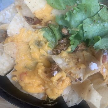 Tarpon Tavern - Grilled chicken nachos, with garnished lettuce on top of the gas station, nacho cheese - American Near Me - Tarpon Springs, Florida