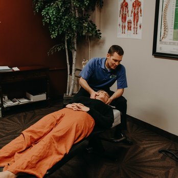OasisPlus Therapies - Dr May adjusting a client - Tanning Near Me - Layton, Utah OasisPlus Therapies - Dr May adjusting a client - Tanning Near Me - Layton, Utah
