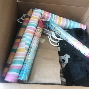 Olympia Moving & Storage - Wrapping paper folded in half and jammed in a box. - Movers Near Me - Hyattsville, Maryland Olympia Moving & Storage - Wrapping paper folded in half and jammed in a box. - Movers Near Me - Hyattsville, Maryland