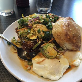 Lucy's - Fried chicken on a biscuit with Brussel sprout slaw, and poached eggs. Sooooo good. - Coffee & Tea Near Me - Grand Rapids, Michigan