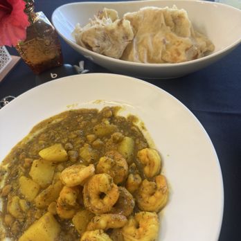Trini Lime Caribbean Cafe - Shrimp curry buss up roti - Trinidadian Near Me - Cayce , South Carolina Trini Lime Caribbean Cafe - Shrimp curry buss up roti - Trinidadian Near Me - Cayce , South Carolina