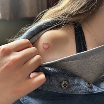 Solana Tattoo Company - fresh red heart (saniderm is on in this photo so it looks a little wrinkled) - Tattoo Near Me - Fort Collins, Colorado