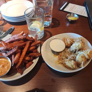 Backlot Pizza + Kitchen - Boneless garlic parmesan wings and sweet potato fries. - Pizza Near Me - Elkhorn, Nebraska Backlot Pizza + Kitchen - Boneless garlic parmesan wings and sweet potato fries. - Pizza Near Me - Elkhorn, Nebraska
