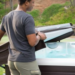 Arvidson Pools & Spas - A cover lifter is a popular accessory to make getting in and out of your new hot tub easier.