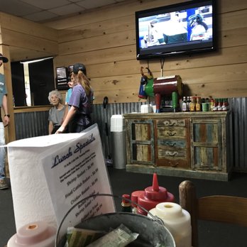 David's Catfish House - a man and a woman in a restaurant - Southern Near Me - Monroeville, Alabama
