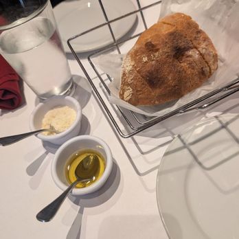 Isabella Ristorante - Fresh bread with olive oil and parmesan cheese - Italian Near Me - Boston, Massachusetts Isabella Ristorante - Fresh bread with olive oil and parmesan cheese - Italian Near Me - Boston, Massachusetts