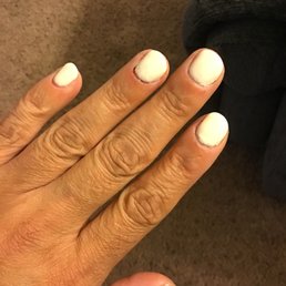 Bleeding cuticles next to pinky, sloppy and uneven polish