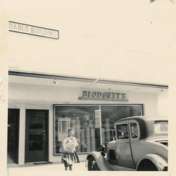 Blodgett's Abbey Carpet & Flooring - Leah Belle Blodgett in front of Blodgett's Original Store c1947