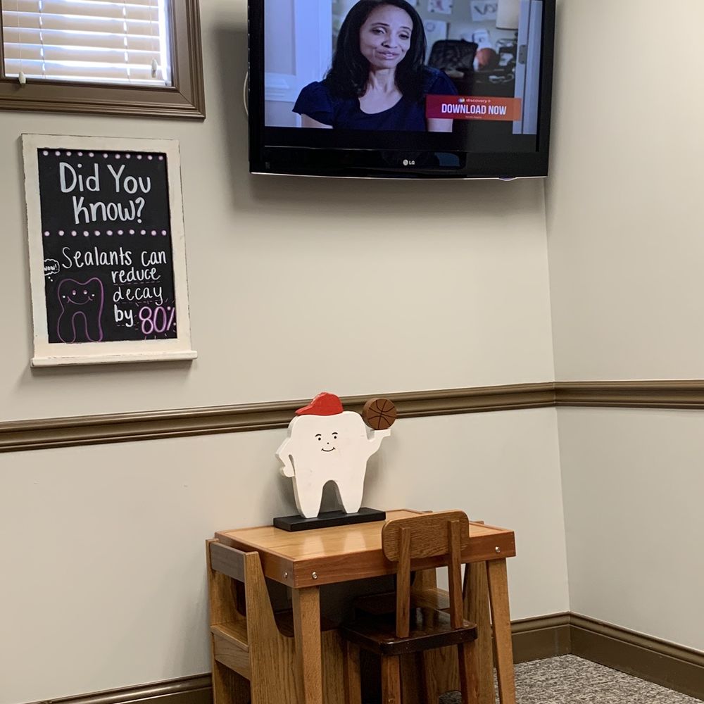 Hadley Family Dentistry - Kids table in waiting area (cute basketball tooth decor) and TV - General Dentistry Near Me - Indianapolis, Indiana