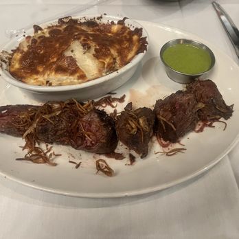 Stoney River - Steak frites and au gratin potatoes with chimichurri - Steakhouses Near Me - Annapolis, Maryland Stoney River - Steak frites and au gratin potatoes with chimichurri - Steakhouses Near Me - Annapolis, Maryland