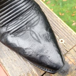 Edwards Boot & Shoe Repair - A beautiful hand made pair of boots in pristine condition brought here for a "little stretch". Leather is DAMAGED BEYOND REPAIR