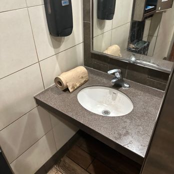 Wendy's - a bathroom with a sink and soap dispenser - Burgers Near Me - South Haven, Michigan