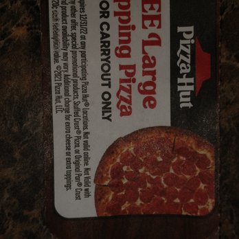 Pizza Hut - a piece of pizza on a table - Chicken Wings Near Me - Whitsett, North Carolina