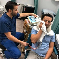 Maya Physical Therapy & Wellness Center - Treating Bell's Palsy patient with electrical stimulation to facial nerves to help stimulate the nerves.