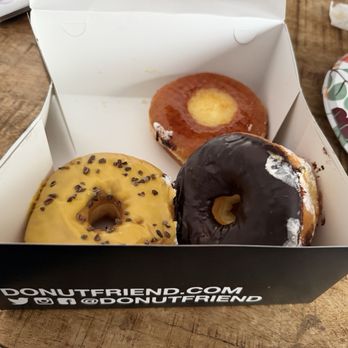 Donut Friend - Crème Youth Brulee, Compassion Fruit, Chocolate frosting - Donuts Near Me - Los Angeles, California Donut Friend - Crème Youth Brulee, Compassion Fruit, Chocolate frosting - Donuts Near Me - Los Angeles, California