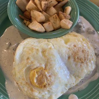The Flying Biscuit Cafe - Biscuits and gravy with 2 eggs over medium and chicken sausage gravy. - Southern Near Me - Houston, Texas The Flying Biscuit Cafe - Biscuits and gravy with 2 eggs over medium and chicken sausage gravy. - Southern Near Me - Houston, Texas