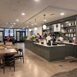 a coffee shop with tables and chairs