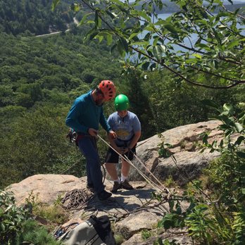 Acadia Mountain Guides Climbing School - Getting instructions from Andrew on rappelling down. - Outdoor Gear Near Me - Bar Harbor, Maine