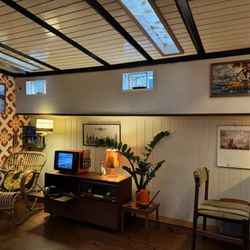 Houseboat Museum - Tv and desk setup across from living room sofas