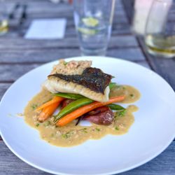 Custom Creations - Delicious Black Cod over glazed baby vegetables and crab buerre blanc