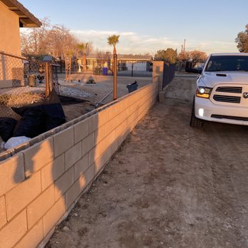 Ecogreen landscaping & designs - a truck parked next to a retaining wall - Landscaping Near Me Ecogreen landscaping & designs - a truck parked next to a retaining wall - Landscaping Near Me