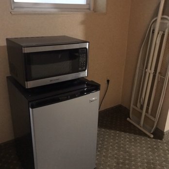 Whitney Inn & Suites - Mini fridge, microwave, and ironing board. (Window was to the bathroom) - Hotels Near Me - Hamden, Connecticut Whitney Inn & Suites - Mini fridge, microwave, and ironing board. (Window was to the bathroom) - Hotels Near Me - Hamden, Connecticut