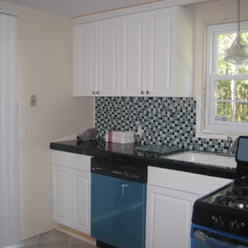 Lucien St.Cyr - Custom Tile Installations - 18" x 18" black granite countertop, with 1" glass mosaic backsplash - Tiling Near Me Lucien St.Cyr - Custom Tile Installations - 18" x 18" black granite countertop, with 1" glass mosaic backsplash - Tiling Near Me