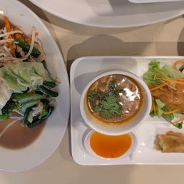 Broth, an egg roll, a small salad, and chicken with vegetables and rice. Broth, an egg roll, a small salad, and chicken with vegetables and rice.