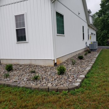 Evergreen Lawncare - the front of a house - Lawn Services Near Me