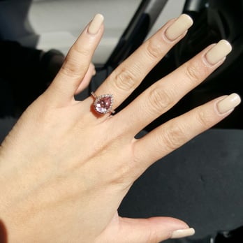 Hugh's Jewelers - My custom designed pear cut morganite in a diamond halo and diamond rose gold band. - Watch Repair Near Me - Brighton, Colorado Hugh's Jewelers - My custom designed pear cut morganite in a diamond halo and diamond rose gold band. - Watch Repair Near Me - Brighton, Colorado