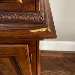 Cain Moving Services - Chip wood off in several location on China Cabinet