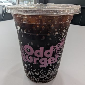 Odd Burger - Odd Burger soda in a clear plastic cup with their logo in pink font on it. - Vegan Near Me - Toronto, Ontario Odd Burger - Odd Burger soda in a clear plastic cup with their logo in pink font on it. - Vegan Near Me - Toronto, Ontario