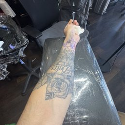 Left arm/wrist tattoo adding more fine line roses & my nephews nickname Left arm/wrist tattoo adding more fine line roses & my nephews nickname