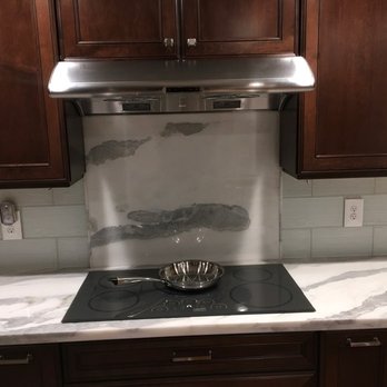 Pius Kitchen & Bath - Since we had extra material due to having to use all 3x8' pieces my wife decided on a slab backsplash. Wei also made us a cutting board. - Kitchen & Bath Near Me - Seattle, Washington