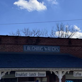 Laughing Waters - a brick building with a sign that says laughing waters - Wine Bars Near Me - Hayesville, North Carolina