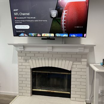 Custom Home Theater - 65" TV with a fireplace mount - Home Theatre Installation Near Me