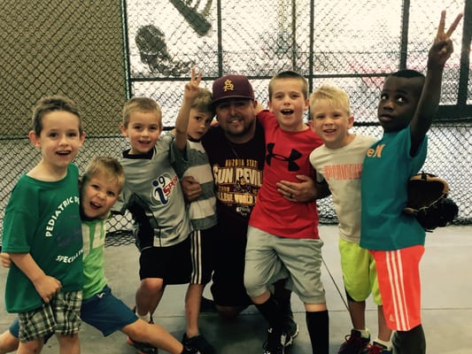 Photo of AZ GRIP-N-RIP Batting Cages - Queen Creek, AZ, US. Coach Dan Contreras with the "Five Little Guys"