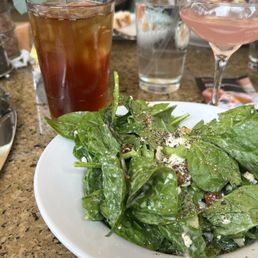 Bardot spinach, pear, feta, walnut salad, iced tea, and cosmopolitan Grey Goose