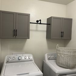Sanders Handyman Service - Got rid of builder shelving and installed cabinets and towel bar. And drywall repair