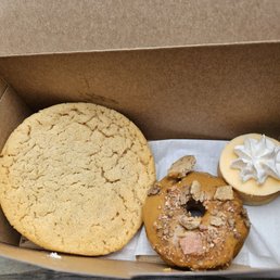 Peanut butter and jelly cookie, puppy donut and orange Creamsicle mini cheesecake Peanut butter and jelly cookie, puppy donut and orange Creamsicle mini cheesecake