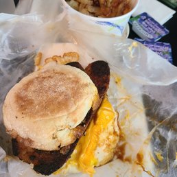 Italian sausage and cheese breakfast sandwich and home fries side