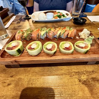 Sushi Umi - On top: Salmon Deluxe Roll( best of this night) On bottom: Geisha Roll( not properly sliced cucumber,unbalanced size of fish pieces) - Japanese Near Me - Herndon, Virginia Sushi Umi - On top: Salmon Deluxe Roll( best of this night) On bottom: Geisha Roll( not properly sliced cucumber,unbalanced size of fish pieces) - Japanese Near Me - Herndon, Virginia