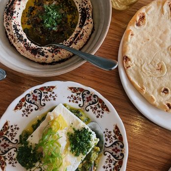 Zhug - burnt onion hummus, leeks and feta, and house-made pita - Mediterranean Near Me - Cleveland Heights, Ohio Zhug - burnt onion hummus, leeks and feta, and house-made pita - Mediterranean Near Me - Cleveland Heights, Ohio