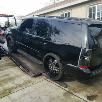 S O S Towing - Getting the tahoe loaded up while making sure no scrapes happen. - Towing Near Me S O S Towing - Getting the tahoe loaded up while making sure no scrapes happen. - Towing Near Me