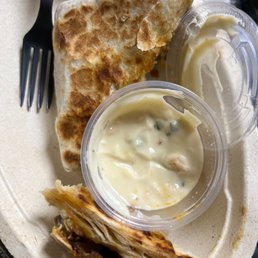 That's a small side of queso for reference on the steak and cheese quesadilla in a burrito bowl! With no sides..