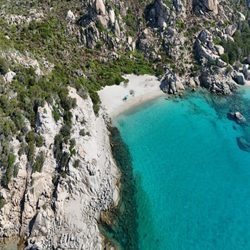 NatourSardinia - Crystal-clear waters and granite coastline in the La Maddalena Archipelago.