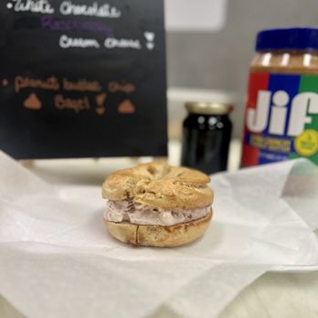 Bagel Boy - Peanut butter bagel with white chocolate raspberry cream cheese. - Coffee & Tea Near Me - Sioux Falls, South Dakota Bagel Boy - Peanut butter bagel with white chocolate raspberry cream cheese. - Coffee & Tea Near Me - Sioux Falls, South Dakota