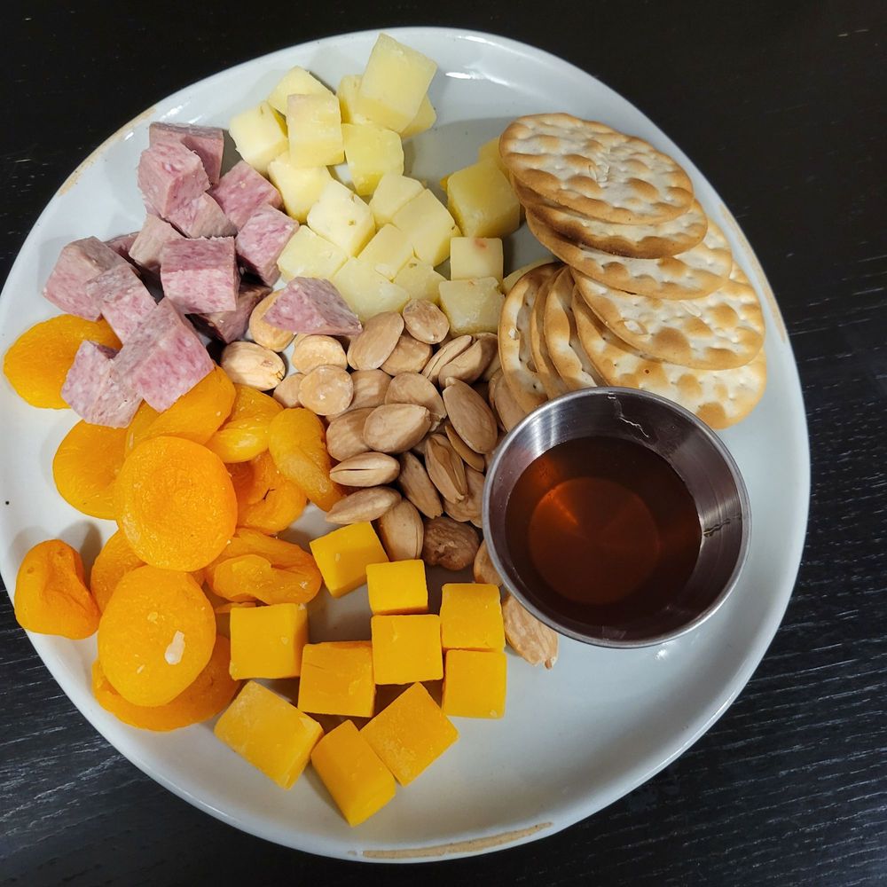 $14 charcuterie plate with dried cheeses and salami
